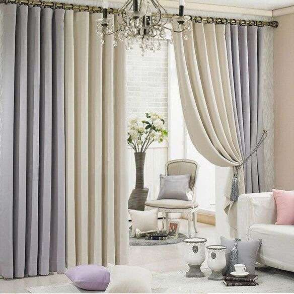 Neutral-colored curtains in beige and grey tones brightening a cozy living space