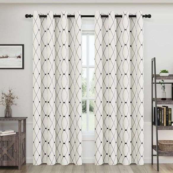 Vertical striped curtains in a modern living room enhancing room height.
