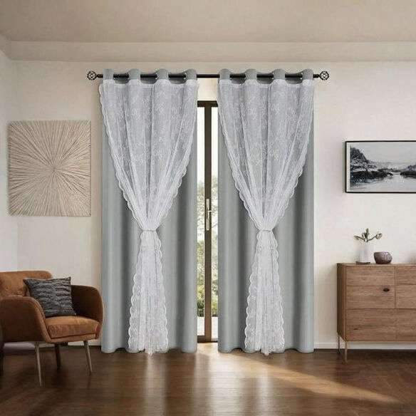 Layered curtains with blackout liners and sheer panels in a cozy living room.