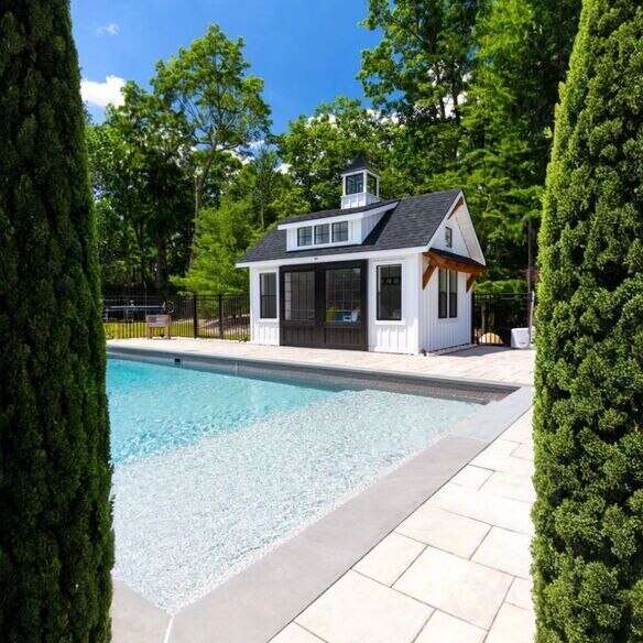 Prefab pool house installed in backyard with fast-build features and modern design