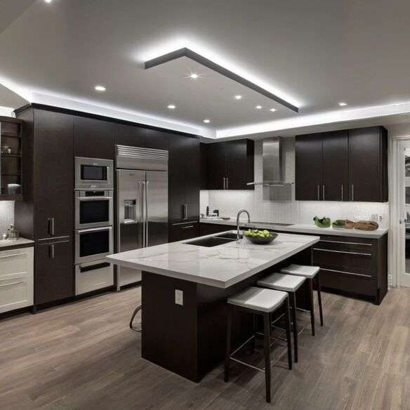 Sleek recessed LED lights installed in a modern white kitchen ceiling