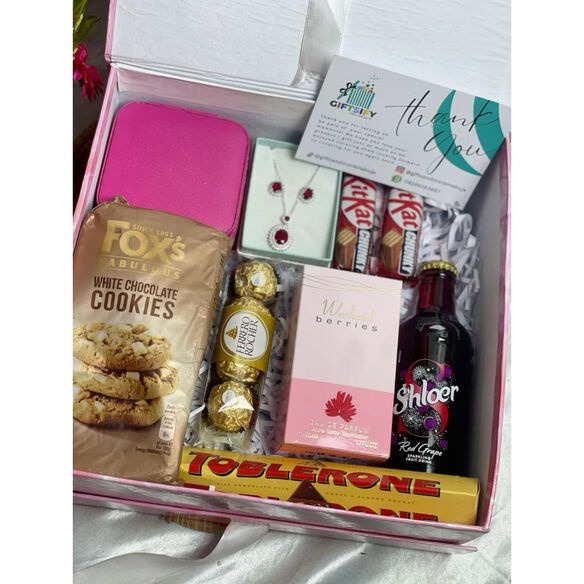 Romantic Christmas gift ideas for wife including jewelry, perfume, silk scarf, and spa products